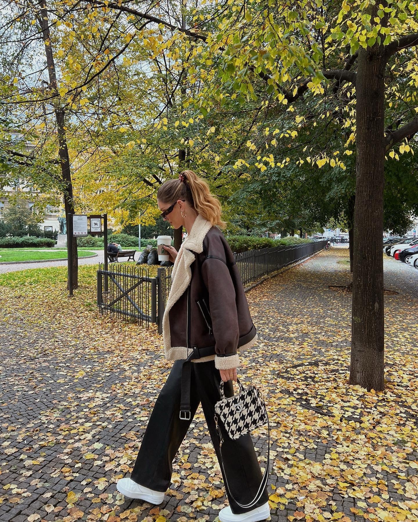 Brown shearling jacket with faux leather zip details