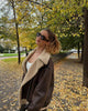 Brown shearling jacket with faux leather zip details