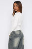 black fitted button-up top with a v-neckline