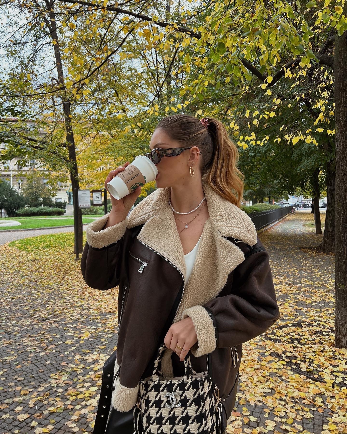 Brown shearling jacket with faux leather zip details