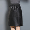 Black elastic waist leather midi skirt with pockets