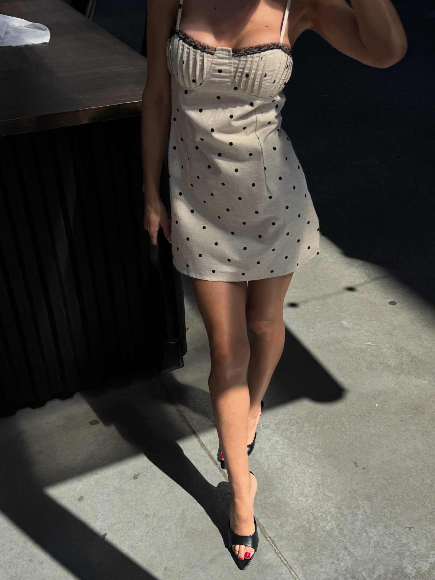 Cream polka dot corset mini dress with black lace trim