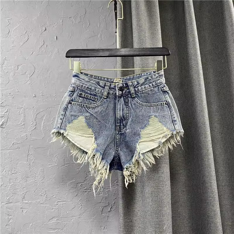 Women ripped denim shorts with fringe