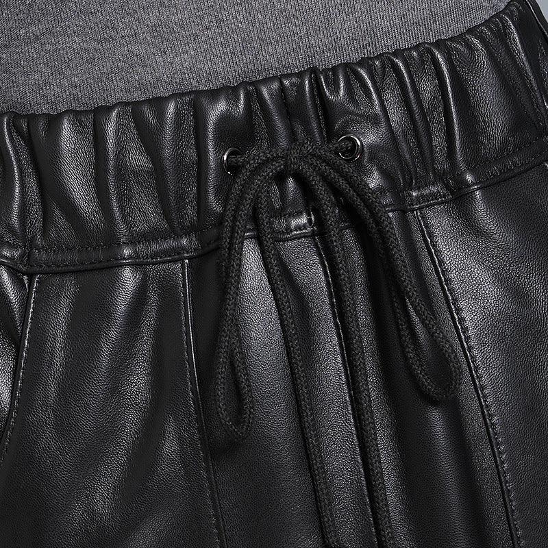 Black elastic waist leather midi skirt with pockets