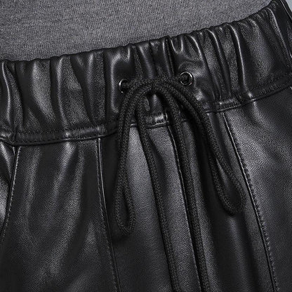 Black elastic waist leather midi skirt with pockets