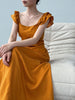 White flutter sleeve linen maxi dress with open back waist fit