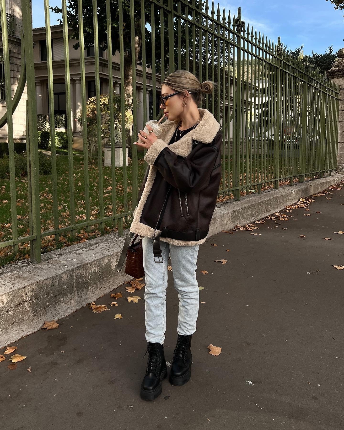 Brown shearling jacket with faux leather zip details