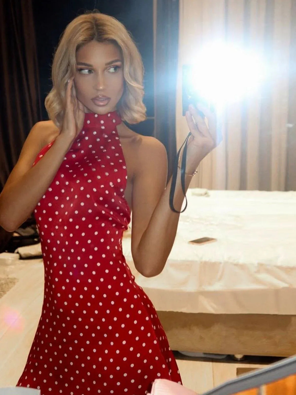 Halter neck polka dot open back dress