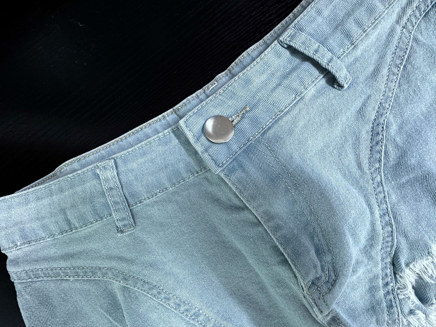 High waisted denim shorts with frayed light wash hem