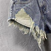 Women ripped denim shorts with fringe
