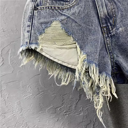 Women ripped denim shorts with fringe