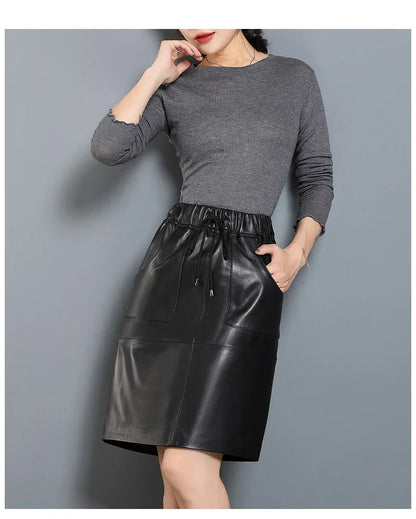 Black elastic waist leather midi skirt with pockets