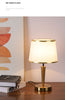 Modern Scandinavian brass table lamp with linen shade