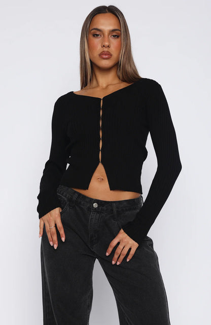 black fitted button-up top with a v-neckline