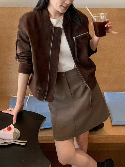 Cropped suede bomber jacket for women in authentic goat leather. Brown suede with ribbed cuffs and motorcycle silhouette for modern autumn layering.