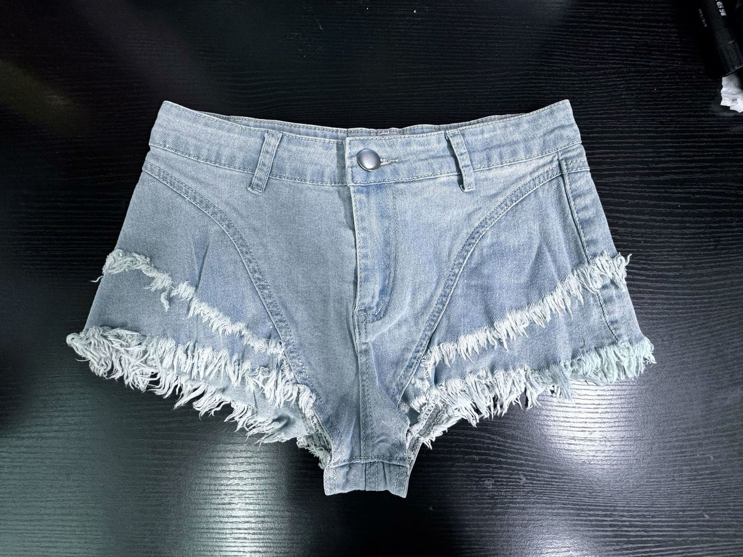 High waisted denim shorts with frayed light wash hem