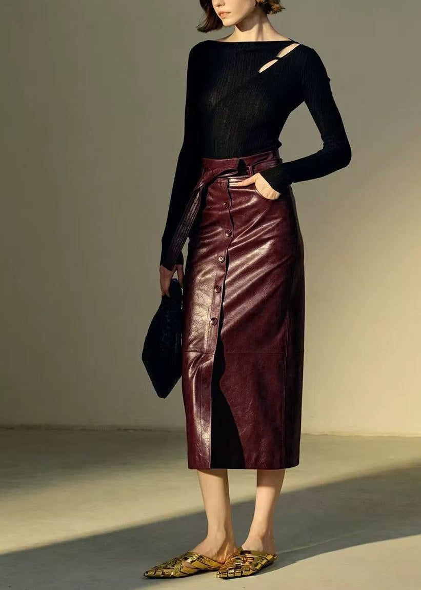 High waisted brown leather skirt crafted in genuine sheepskin. Midi to maxi length with slit and button detail. Premium leather skirts for women.