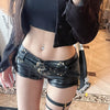Black faux leather shorts with belted low rise fit