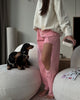 Pink distressed jeans with high waist and wide leg fit