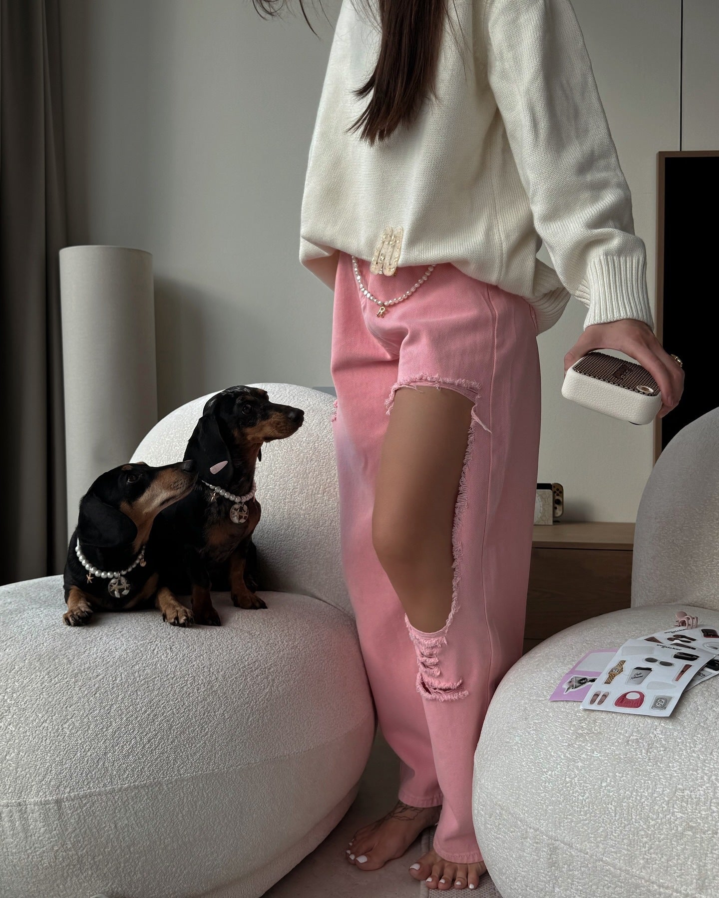 Pink distressed jeans with high waist and wide leg fit