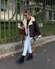 Brown shearling jacket with faux leather zip details