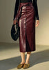 Women’s leather skirt in dark maroon sheepskin. High waist, lace-up belt, button front, and slit. Ideal long leather skirt for office to evening wear.