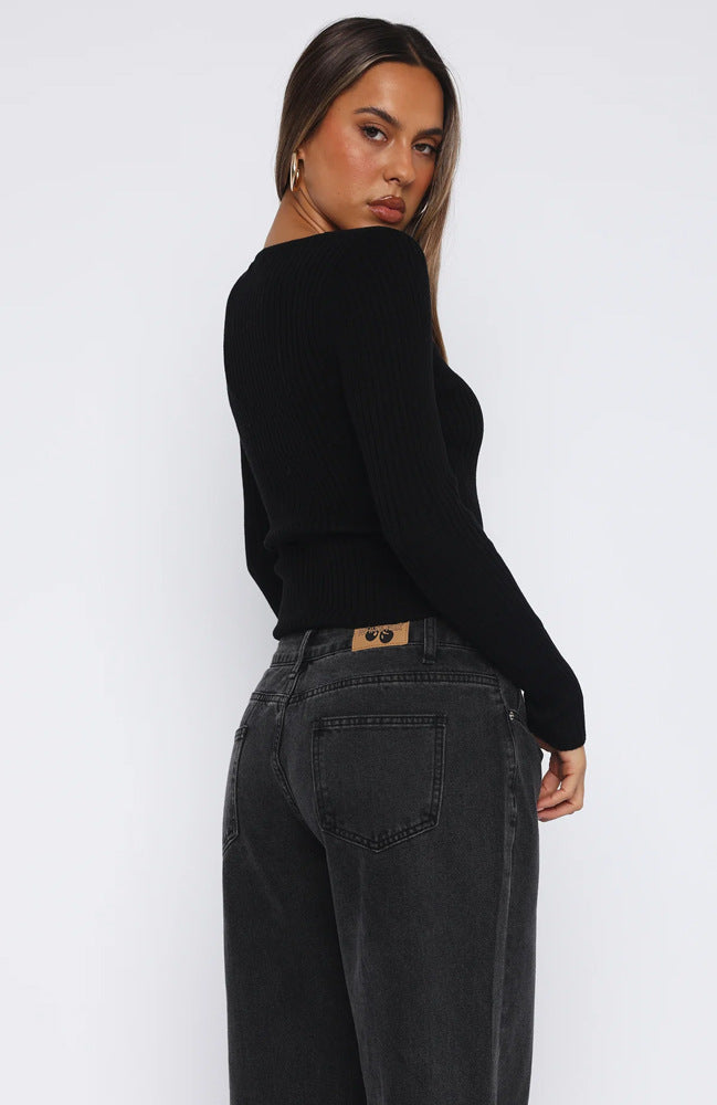 black fitted button-up top with a v-neckline