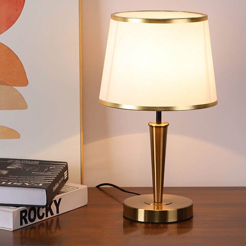 Modern Scandinavian brass table lamp with linen shade