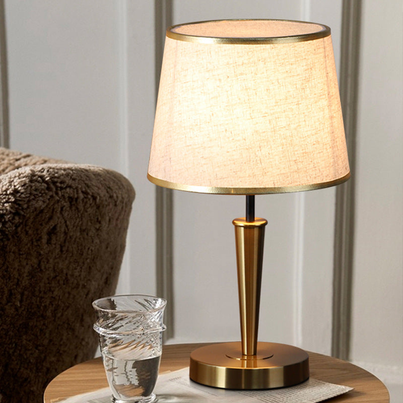 Modern Scandinavian brass table lamp with linen shade