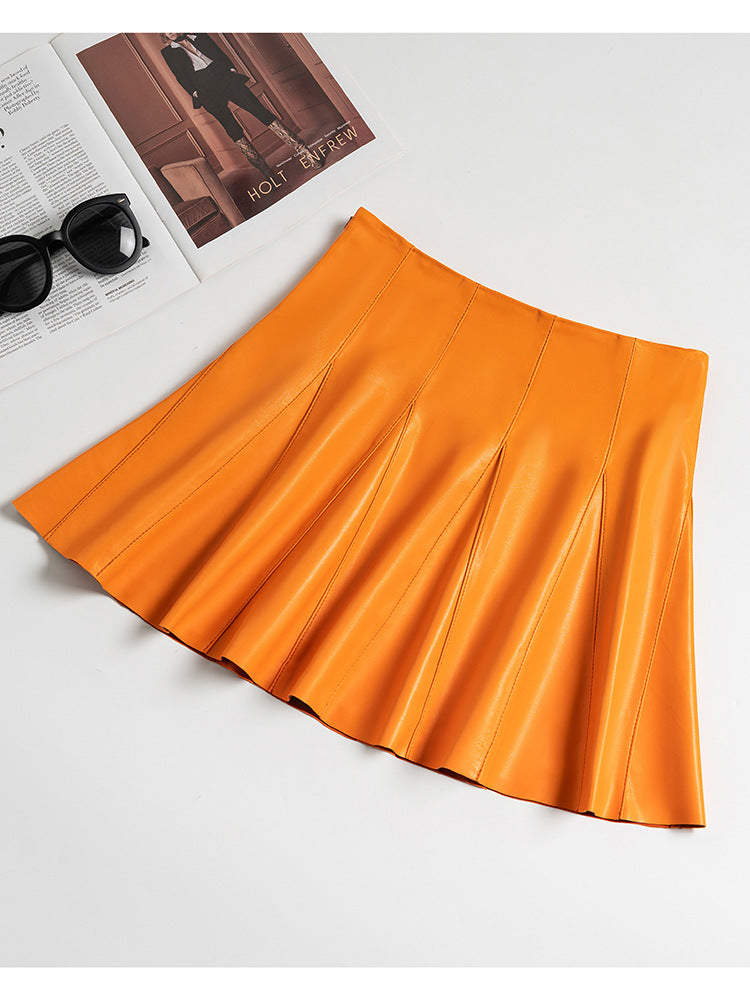Premium sheepskin leather mini skirt for women. High waist, umbrella pleats, and chic design for versatile styling all season long.