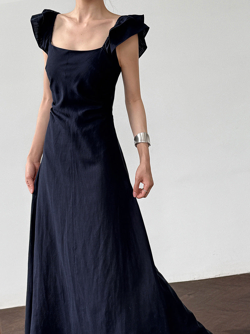 White flutter sleeve linen maxi dress with open back waist fit