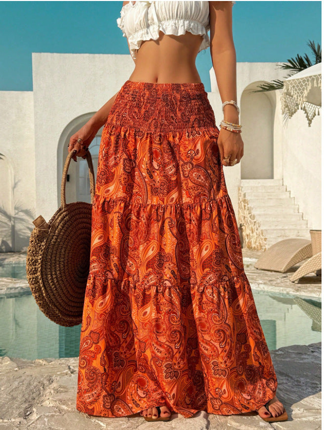 Smocked waist maxi skirt with tiered paisley print