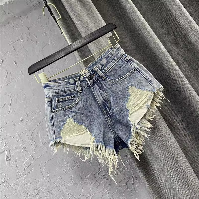 Women ripped denim shorts with fringe