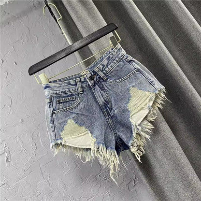 Women ripped denim shorts with fringe