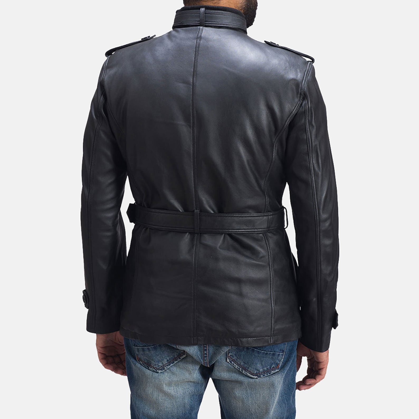 Close-up of a sleek black leather jacket with a quilted shoulder design and a zippered front.