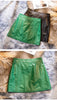 Women's mini leather skirt in black and green