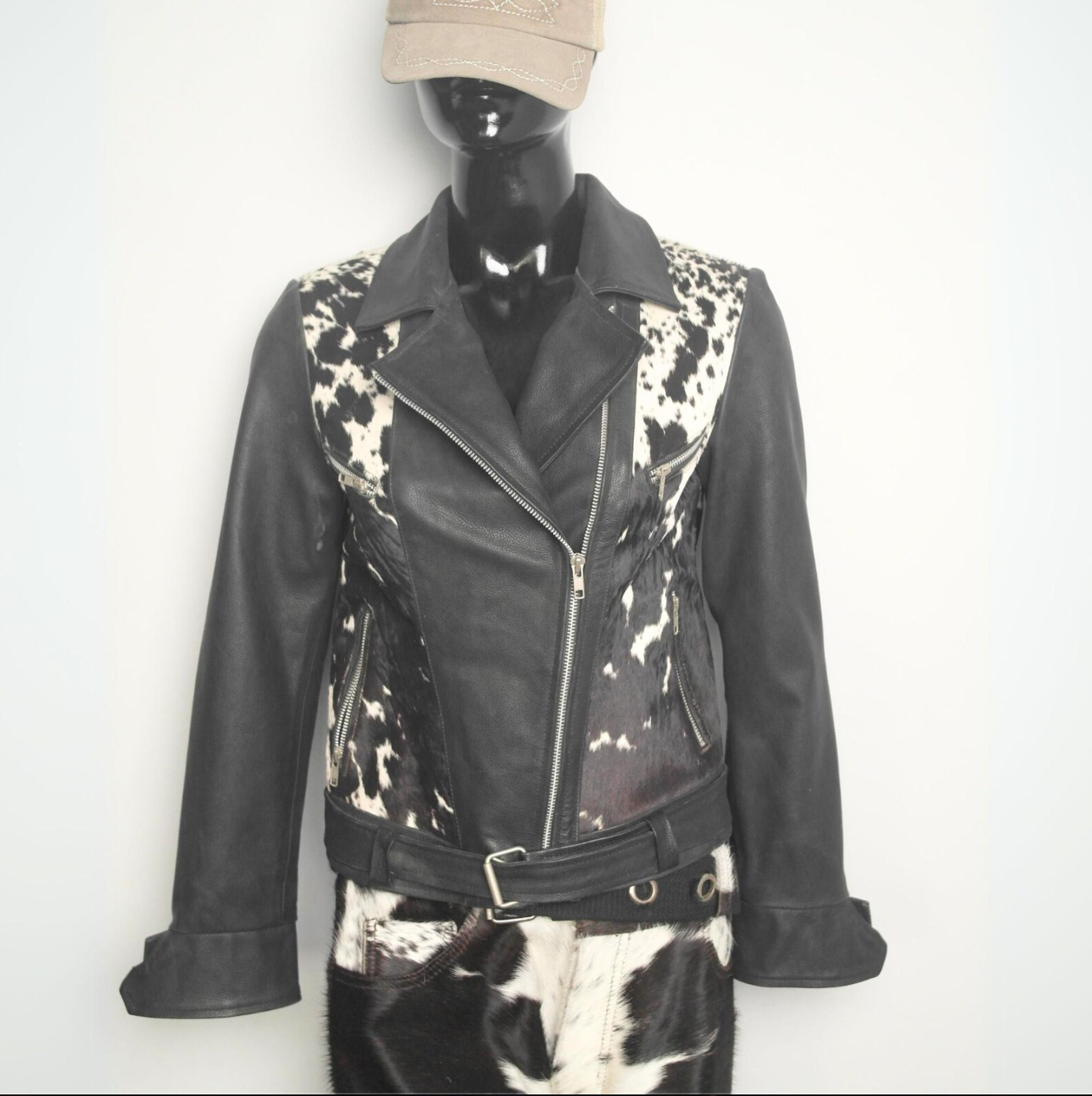 Women’s cow fur jacket made from genuine cowhide and sheepskin leather, designed with natural patterns and custom sizing options.

