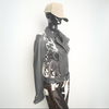 Black and white cowhide leather jacket for women with a belted waist, unique cow print, and bold western influence.

