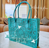 Turquoise hand tooled leather purse