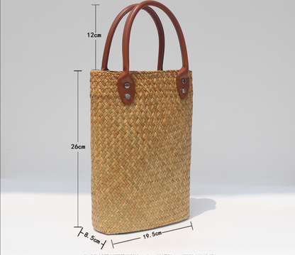 Natural straw beach tote with brown leather handles
