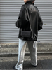 Oversized black leather jacket with drop shoulder