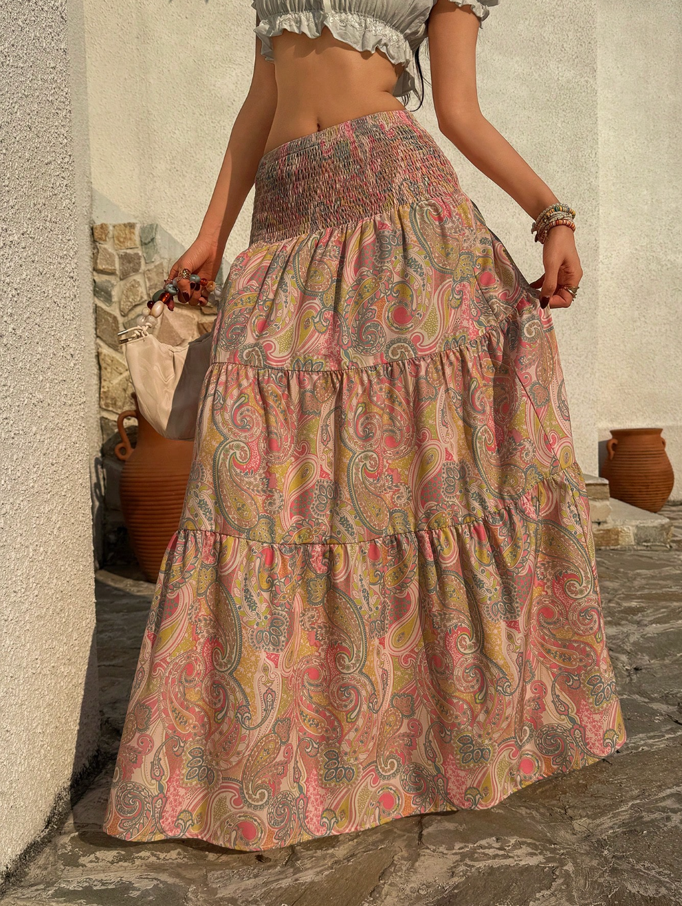 Smocked waist maxi skirt with tiered paisley print