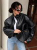 Women's cropped leather jacket featuring metallic hardware and full front zipper closure