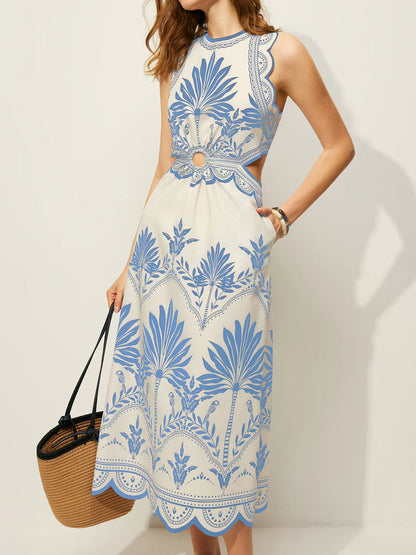 Sleeveless tropical beach dress with a high neckline and softly gathered midi skirt.