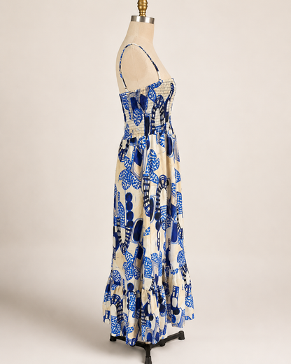 Smocked Back Blue Maxi Dress | Back view of the maxi dress showing the smocked rear bodice, open upper back, and adjustable thin straps.