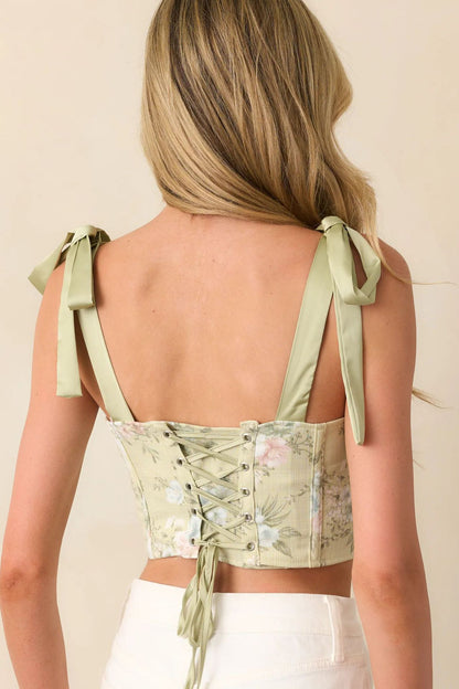 Corset top with floral print tie straps and lace up back