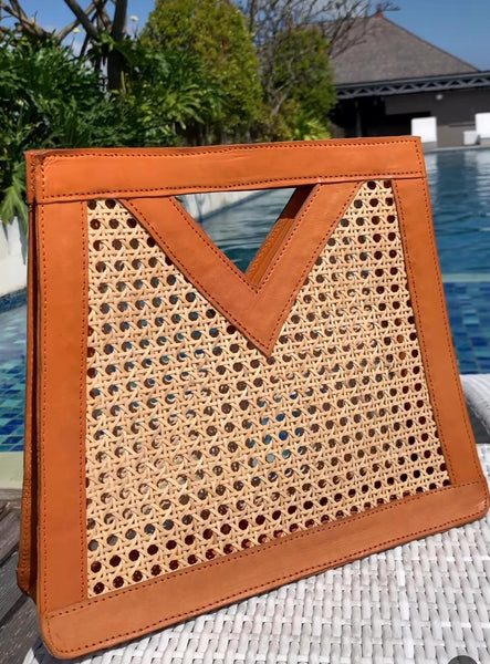 Discover the ultimate statement piece - our V Style Leather Rattan Handbag. Crafted with premium materials, it's a must-have for fashion-forward individuals.