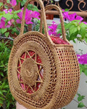 Round rattan bag with handle