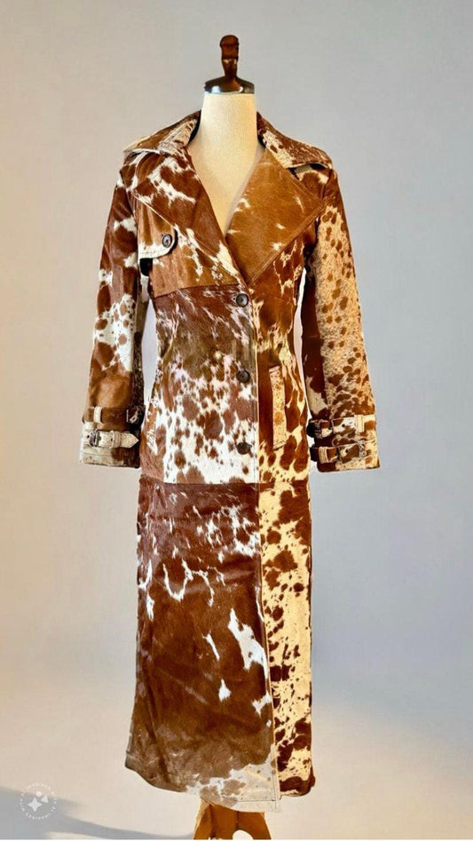 Authentic cow skin trench coat for women with bold western styling. Perfect outerwear piece for rodeo, ranch, and country concerts.