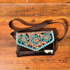 tooled cowhide sling messenger bag bag